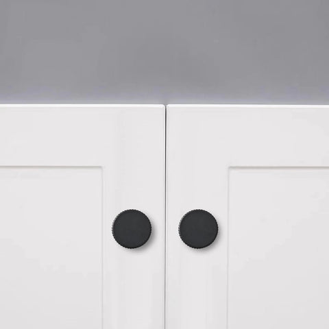 Matte Black Cabinet Knob Set Five Pack For Kitchen Drawers And Furniture Doors installed on white cabinets