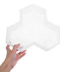 Hand holding a Maple Leaf Concrete Brick Mold Set 2 Pieces Reusable Stepping Stone Paver for Garden Patio Lawn Walkway.