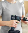 Person using Built Tough 18V Compact Cordless Drill Workhorse Kit with keyless chuck in a workshop setting.