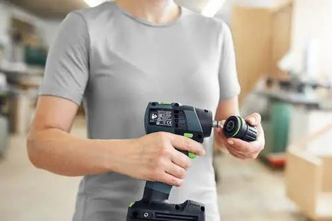 Person using Built Tough 18V Compact Cordless Drill Workhorse Kit with keyless chuck in a workshop setting.