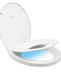 Round Toilet Seat With Slow Close And Quick Release Easy Clean Plastic In White Standard Round Size For Family Bathrooms Kid Friendly With Magnetic Child Seat That Stows And Never Slams with visible child seat and night light.
