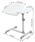 Smooth Rolling Tilt Top Height Adjustable Standing Desk With Heavy Duty Carbon Steel Frame And Locking Wheels For Seamless Over Bed Workstations And Lowkey Productive Home Office Vibes dimensions shown with a white tabletop and grey frame.