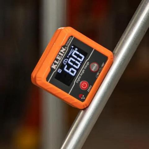 Front view of Klein Tools 935DAG orange digital level on a metal tube, displaying angle reading.