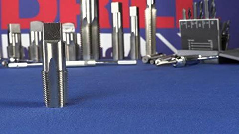 Front view of Drill America POU set featuring 1/8 NPT pipe tap and high-speed steel drill bits on blue work surface