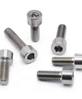 Heavy Duty Hardcore TC4 Titanium Cup Head Hex Socket Screws For Precision Machinery And Electronic Assembly Tight Fitting M20 Metric Grade Fasteners laid out, showcasing smooth cup heads and various lengths.