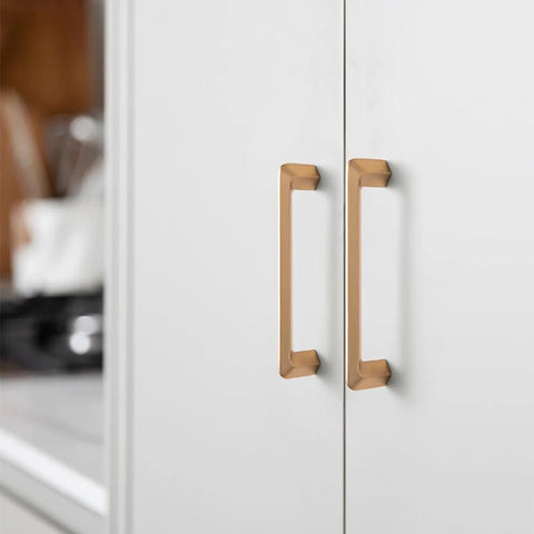 Champagne Bronze Zinc Alloy Cabinet Handles 5 Inch Center To Center 128mm installed on white cabinet doors