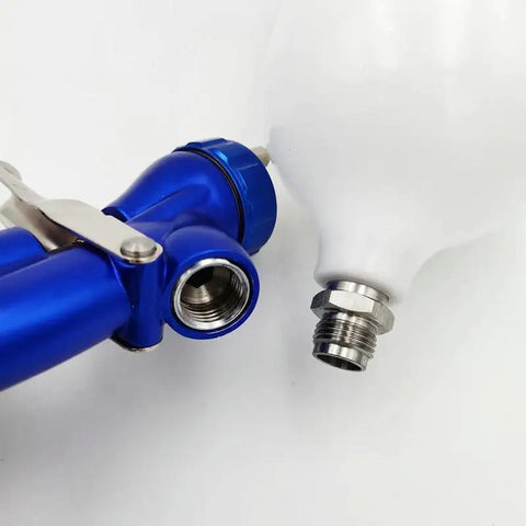 Close-up of Heavy Duty Pneumatic Spray Gun For Automotive Paint And Bodywork Topcoats Featuring High Atomization Build with blue body.