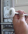 Ultra Quiet Sealed 6200ZZ Nylon Garage Door Rollers Wheel With 11 Ball Bearings 2 Inch Roller 4 Inch Stem viewed during installation