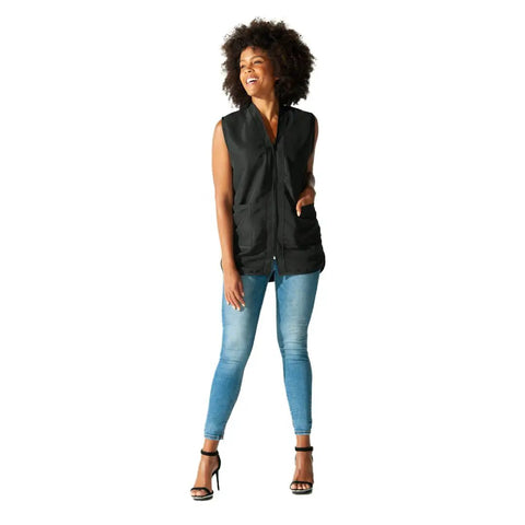 Built Tough Salon Vest With Smooth Zip Front Showing Off Cool Iridescent Drip Designed To Help Pro Hairstylists And Barbers Crush Their Shifts Tailors Snugly For All Day Ease In Classy Black Medium Fit, on model with curly hair.