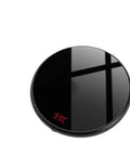 Sleek Compact Electric Mug Warmer With Smart Thermostat Temperature Settings And Tap Activated Heating Pad That Keeps Your Favorite Coffee Or Tea Piping Hot Always, black circular design with digital temperature display.