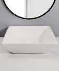 USZWBY Vessel Sinks Bathroom Vessel Sink Modern Square Ceramic Counter Basin White Bathroom Bowl Sink on countertop with round mirror.