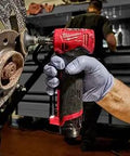 Top Shelf Brushless Right Angle Die Grinder 12V Cordless Powerhouse, handheld, working on a rusted brake component in a garage.