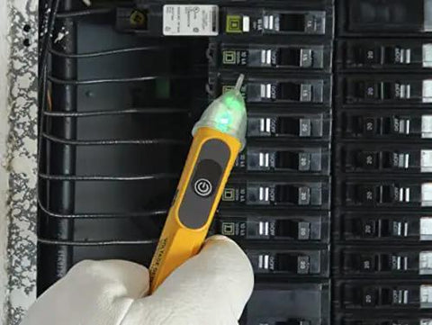 Non-Contact Voltage Tester 50-600V CAT IV 600V NCVT With LED Indicator in use by panel, glove visible