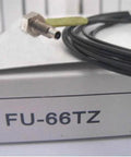 Close-up of Keyence FU-66TZ Fiber Optic Sensor Replacement, showing plug and cable on FU66TZ-labeled box, ideal for automation use.