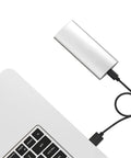 Slick Aluminum M.2 To Type C Enclosure For B Key Ssd Up To 2tb Fast Usb 3.1 Docking Station connected to a laptop.