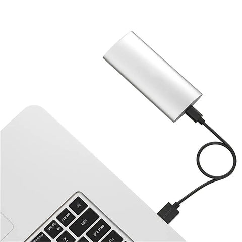 Slick Aluminum M.2 To Type C Enclosure For B Key Ssd Up To 2tb Fast Usb 3.1 Docking Station connected to a laptop.