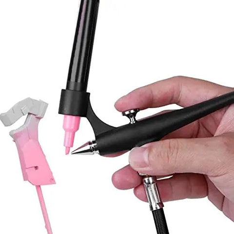 Close-up of Slick Portable Marker Airbrush Sprayer Kit For Smooth Coloring And Hassle Free Paint Swapping With Fine Mist Coverage and Universal Adapter Connector, showing hand holding device with pink marker.
