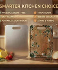Front view of stainless steel kitchen cutting boards; two boards on a counter, metal and clear resin with green specks.