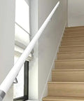 Sleek White Wooden Stair Banister Kit Wall Mounted Handrail For Interior Steps Heavy Duty Safety Grab Rail mounted on staircase.