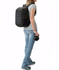 Person wearing Rugged Outdoor Camera Backpack For DSLR Gear Fits Kit Lens Up To 18 To 135mm Plus Extra Lenses And Flash