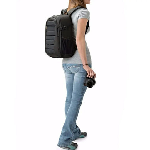 Person wearing Rugged Outdoor Camera Backpack For DSLR Gear Fits Kit Lens Up To 18 To 135mm Plus Extra Lenses And Flash