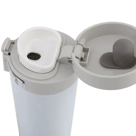 Dope 380 Ml Double Wall Stainless Steel Coffee Mug With Solid Lock Leak Proof Push Button Lid and Built In Mesh Filter top view showing lid design.