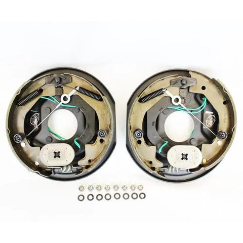 Two round trailer electric brake assemblies with green wiring and springs for 5-4.5 in bolt circle on a 3,500 lb axle