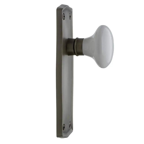 Side view of Prairie Plate With White Porcelain Lead Crystal Knob Door Passage Set In Antique Pewter, Solid Brass Plates