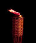 Lit outdoor torch with red flame using Red Flame Torch Fuel Citronella Scented Ready To Use No Spill No Mess 8 Ounce Container 4 Pack