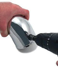 Spectre Performance 8711 vacuum sensor adapter kit, chrome automotive adapter held by hand next to a Craftsman drill