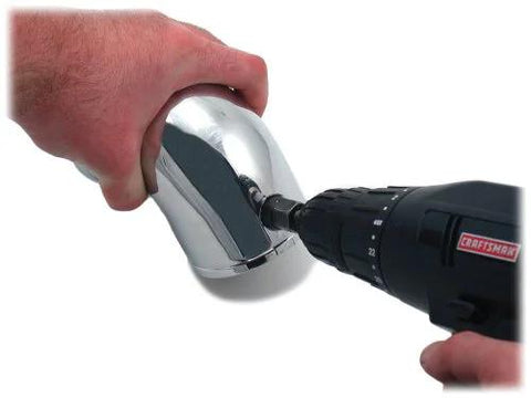 Spectre Performance 8711 vacuum sensor adapter kit, chrome automotive adapter held by hand next to a Craftsman drill