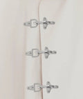Four Pairs Of Silver Zinc Alloy Web Joint Buckles For Crafts, Built Tough To Beat Wear And Tear, Adjustable Airplane Style Buckles For DIY Projects, Perfect For Belts, Straps, Bags, And Garments. Three silver zinc alloy web joint buckles on light fabric.