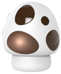 Decorative mushroom-shaped white and brown lamp with round cutouts on the base and shade.