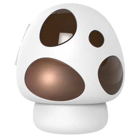 Decorative mushroom-shaped white and brown lamp with round cutouts on the base and shade.