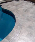 Premium Dead Simple Water Based Non Slip Floor Sealer And Coating For Slippery Tiles And Concrete applied on textured patio near pool.