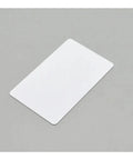 Flat view of 230 Piece Slick White Blank Inkjet Printable Cards Waterproof Plastic Id Business Tags on gray background.