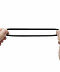 Hands holding a Universal Sewing Machine Stretch Motor Belt 13 To 15 Inch Easy Fit Replacement Belts 2 Pack in black nitrile rubber material.