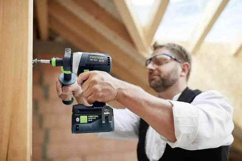 Pro using Badass Cordless Drill Driver Featuring Ec Tec Brushless Motor High Torque Heavy Duty Power Tool on beam.