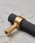 Close-up of Set Of 2 Solid Brass Cabinet Pulls 6.3 Inches Long With 5 Inch Hole Centers Knurled Textured Handles In Gold And Black Finishes