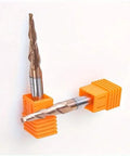 Front view: two orange carbide end mills with spiral flutes held in clamps.