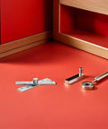 Six Pack CATIEBYE 360 Degree Rotation Stainless Steel Invisible Pivot Door Hinges for Wood Cabinets displayed on red surface