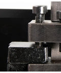 Metal woodturning tool rest clamp with adjustment screws; black steel body and chrome bolts.