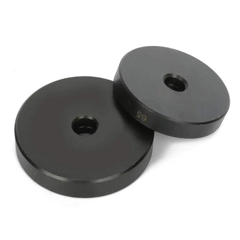 Two black interchangeable discs from the 52 In 1 Custom Bushing Driver Tool Set Pro Grade All In One Kit, side by side.