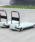 Heavy Duty Electric Scissor Lift Table With 660 Pounds Capacity Hella Sturdy Foldable Frame And Slick One Touch Operation smooth platform on warehouse floor.