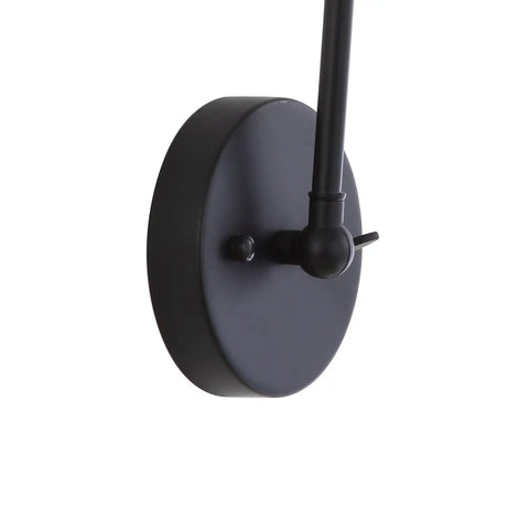 Close-up of Industrial Style LED Wall Sconce with Adjustable Swing Arm Black and Brass Gold Metal Shade Bedside Reading Light