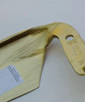 Close-up of Austner Hand Forged Austrian Scythe Blade tip showing engraving details, curved design for harvesting grain and grass.