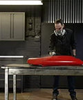 CAR-REP 2K polyurethane clear coat aerosol being applied to a red car hood on a worktable