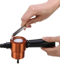 Hands using Power Drill Nibbler Attachment With 360 Degree Adjustable Double Head Metal Sheet Cutter And Wrench, silver orange