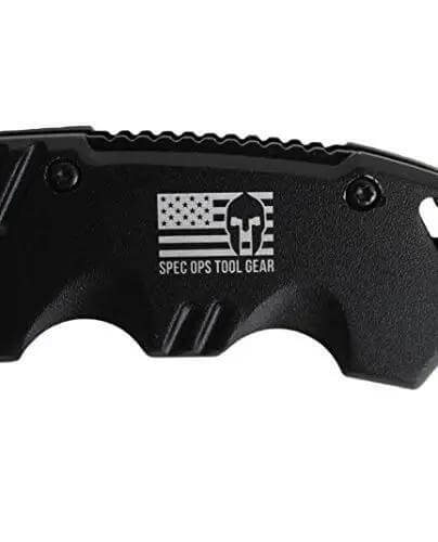 Close-up of beefy grip on spring assisted folding knife with 3.5 inch steel blade, fast deploy one hand open, built for work.