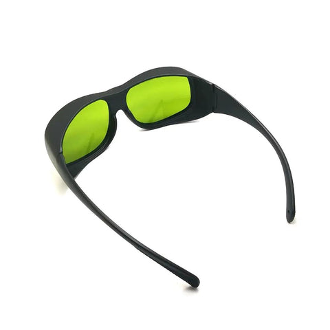 Real Deal Eye Protection With Heavy Duty Infrared Laser Glasses For Dental Diode Tools Featuring OD 1 At 660 Nm And OD 5 Up To 1095 Nm With Clear Coated Lenses, black frame with green lenses, angled view.